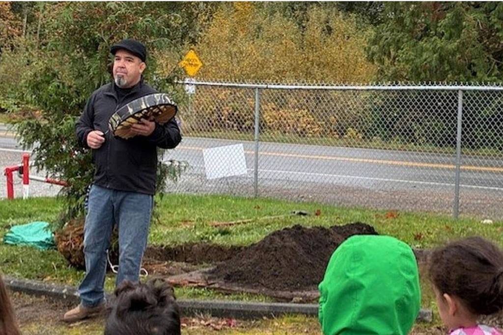 Semiahmoo First Nation (SFN) Chief Harley Chappell leading the cedar tree planting ceremony at Xw’epiteng Elementary (Lys Paredes/Contributed to Peace Arch News)