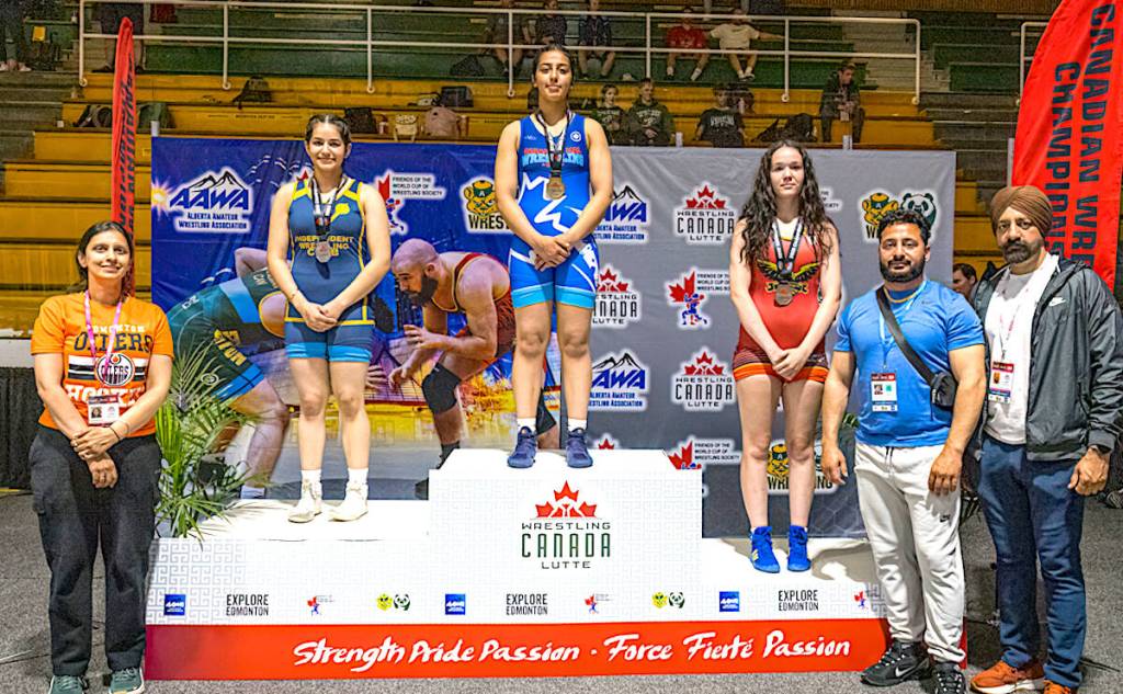 Khushleen Jhalli of Surrey stands atop the podium at a Canadian wrestling championship event in Edmonton in May 2025. (Contributed/Wrestling Canada Lutte photo)